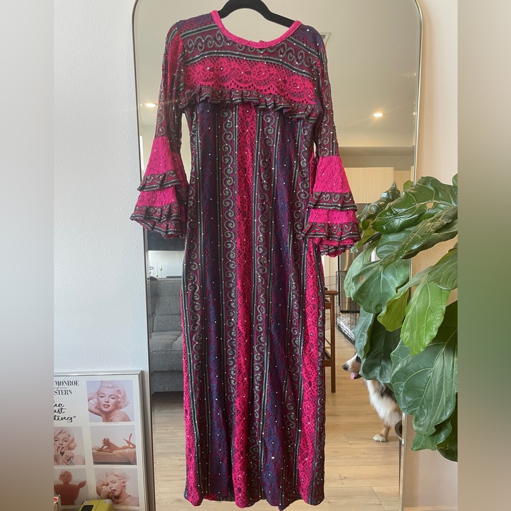 Long, intricate, colorful dress with bell sleeves; fits like a size 8 or 10